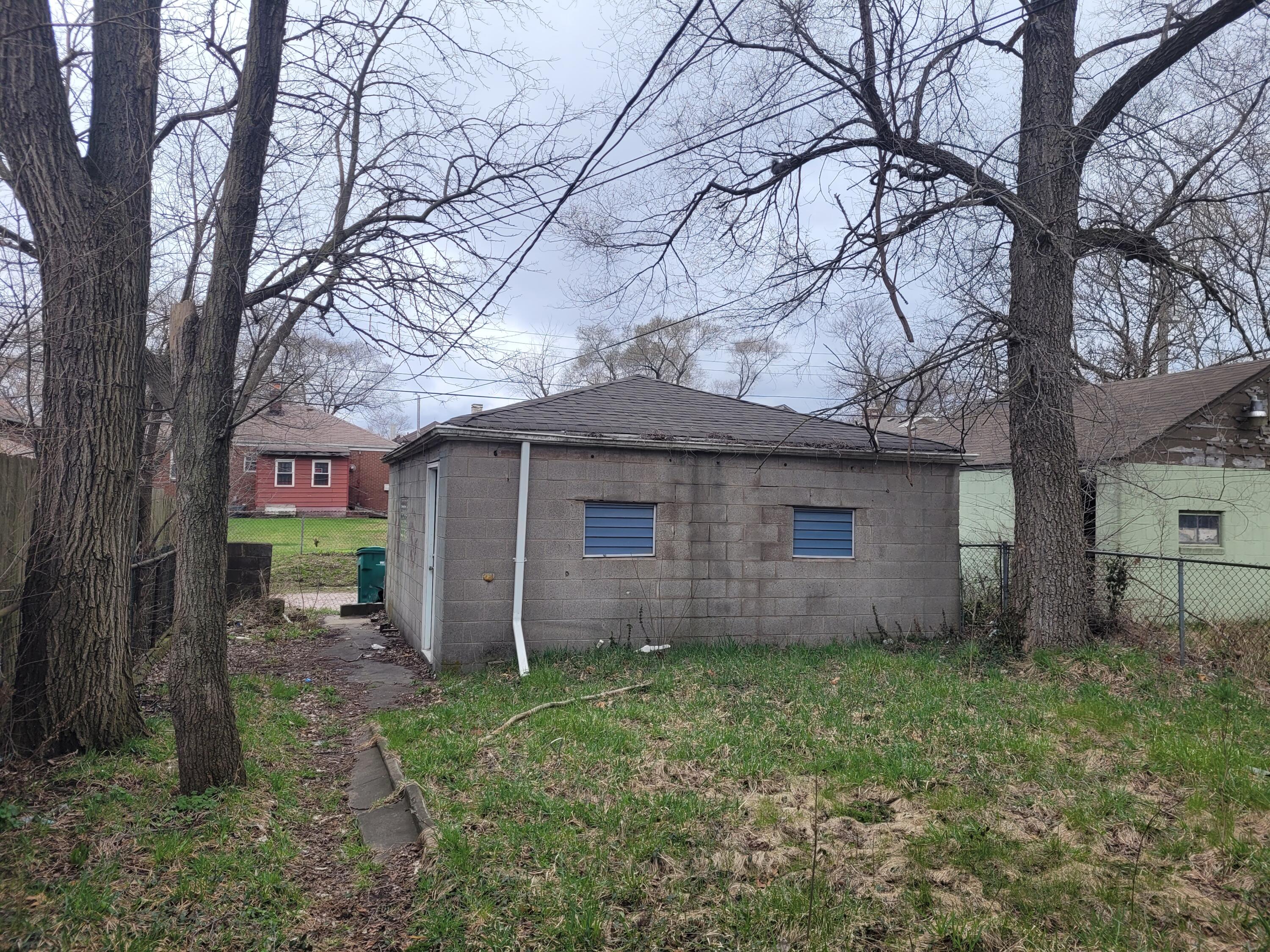 824 Tyler Street Gary, IN 46402 - Photo 13 of 14 a barn in the middle of a yard