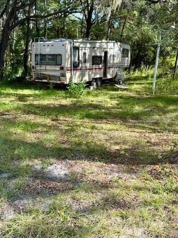 a view of a house with a big yard