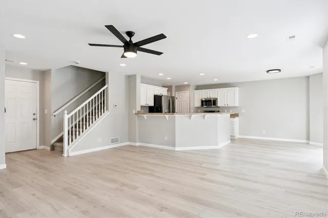 a view of a kitchen with a ceiling fan