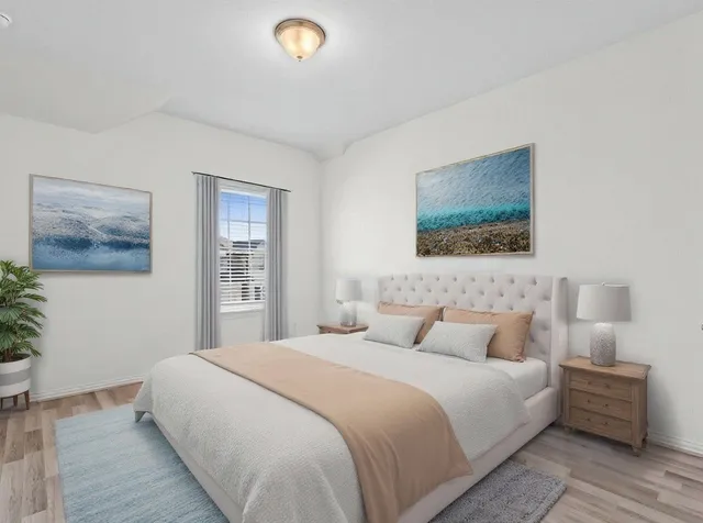 a bedroom with a bed and a couch