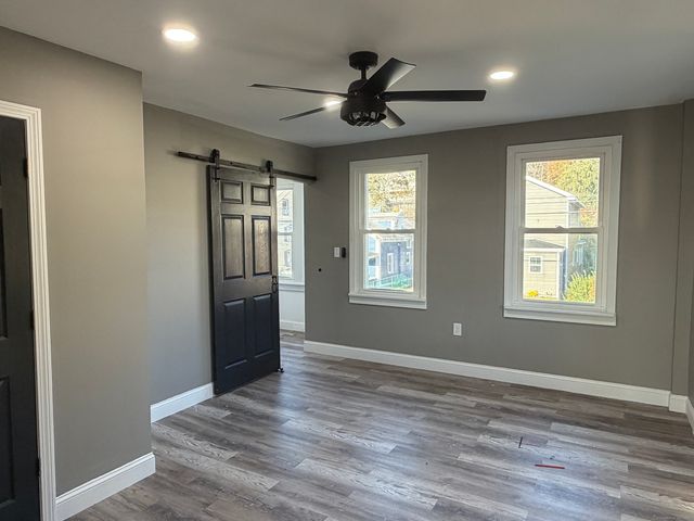 a view of an empty room with a window