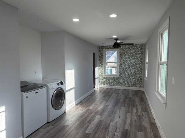 a view of a storage & utility room with washer and dryer