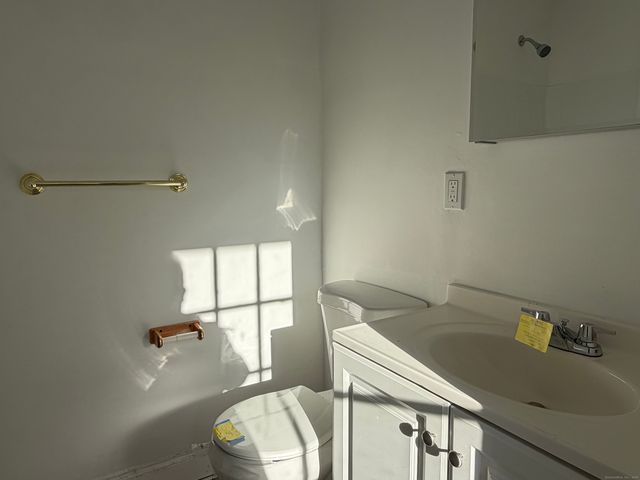 a bathroom with a sink and toilet