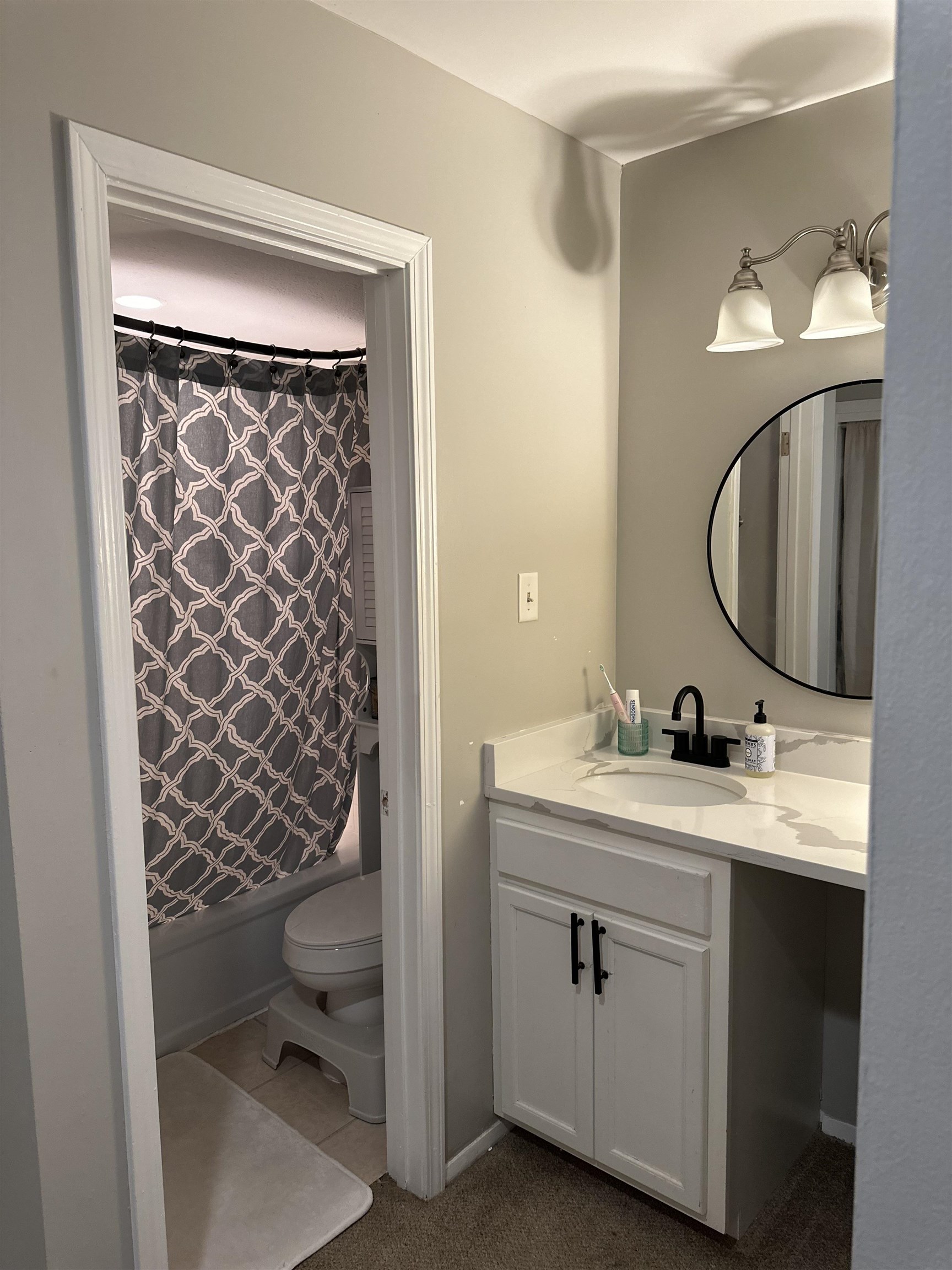 3081 Rising Sun Road, Unit 46 Lakeland, TN 38002 - Photo 18 of 30 a en suite bathroom with a toilet sink and mirror