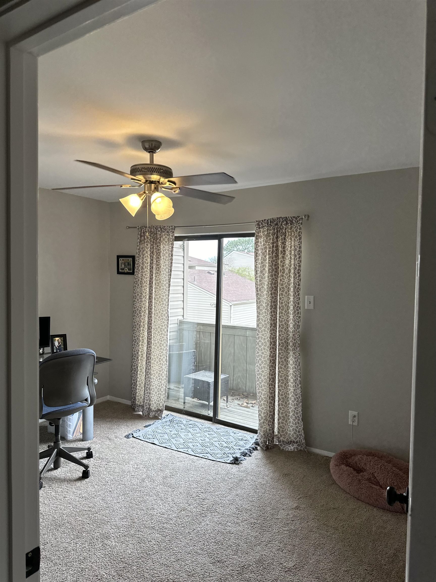 3081 Rising Sun Road, Unit 46 Lakeland, TN 38002 - Photo 24 of 30 a view of a room with gym equipment and a large window