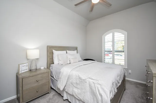 a kitchen with white cabinets and a stove top oven