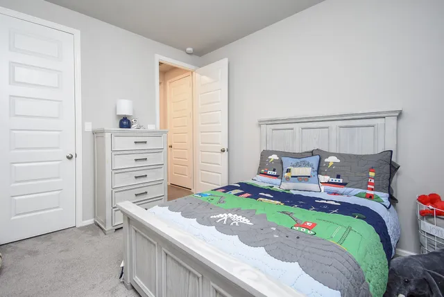 a living room with furniture and a view of kitchen
