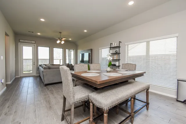 a view of a house with backyard and porch