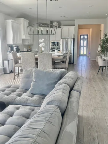 a living room with furniture kitchen view and kitchen view
