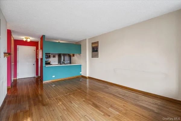 a view of kitchen and wooden floor