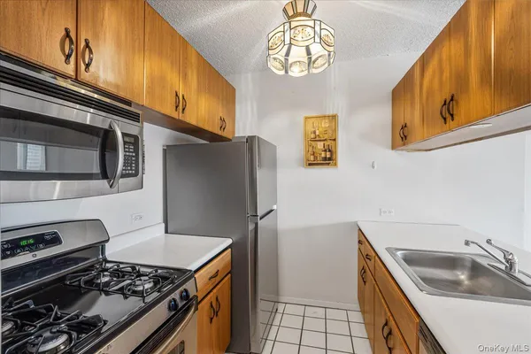 a kitchen with a stove and a sink