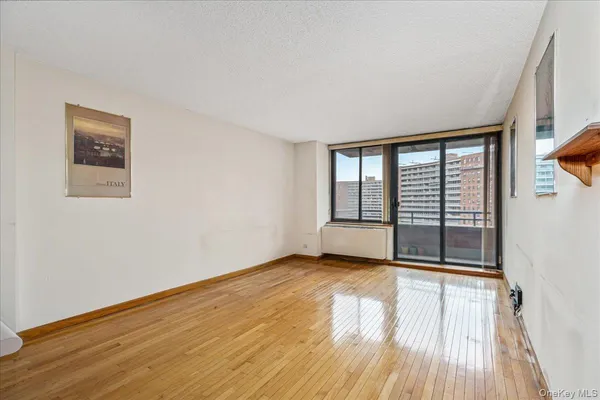 a view of an empty room with glass door