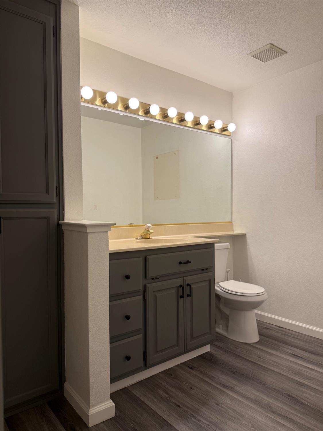 8020 Walerga Road, Unit 1093 Antelope, CA 95843 - Photo 11 of 13 a bathroom with a sink and a mirror