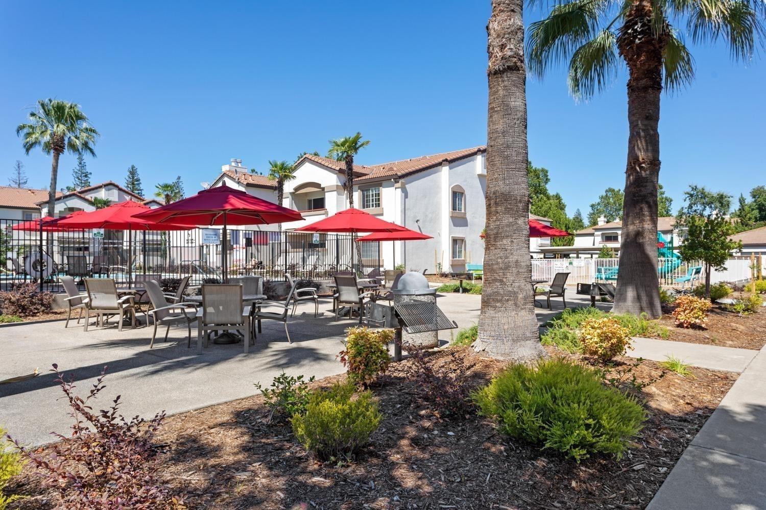 8020 Walerga Road, Unit 1093 Antelope, CA 95843 - Photo 3 of 13 a view of a swimming pool with chairs and tables