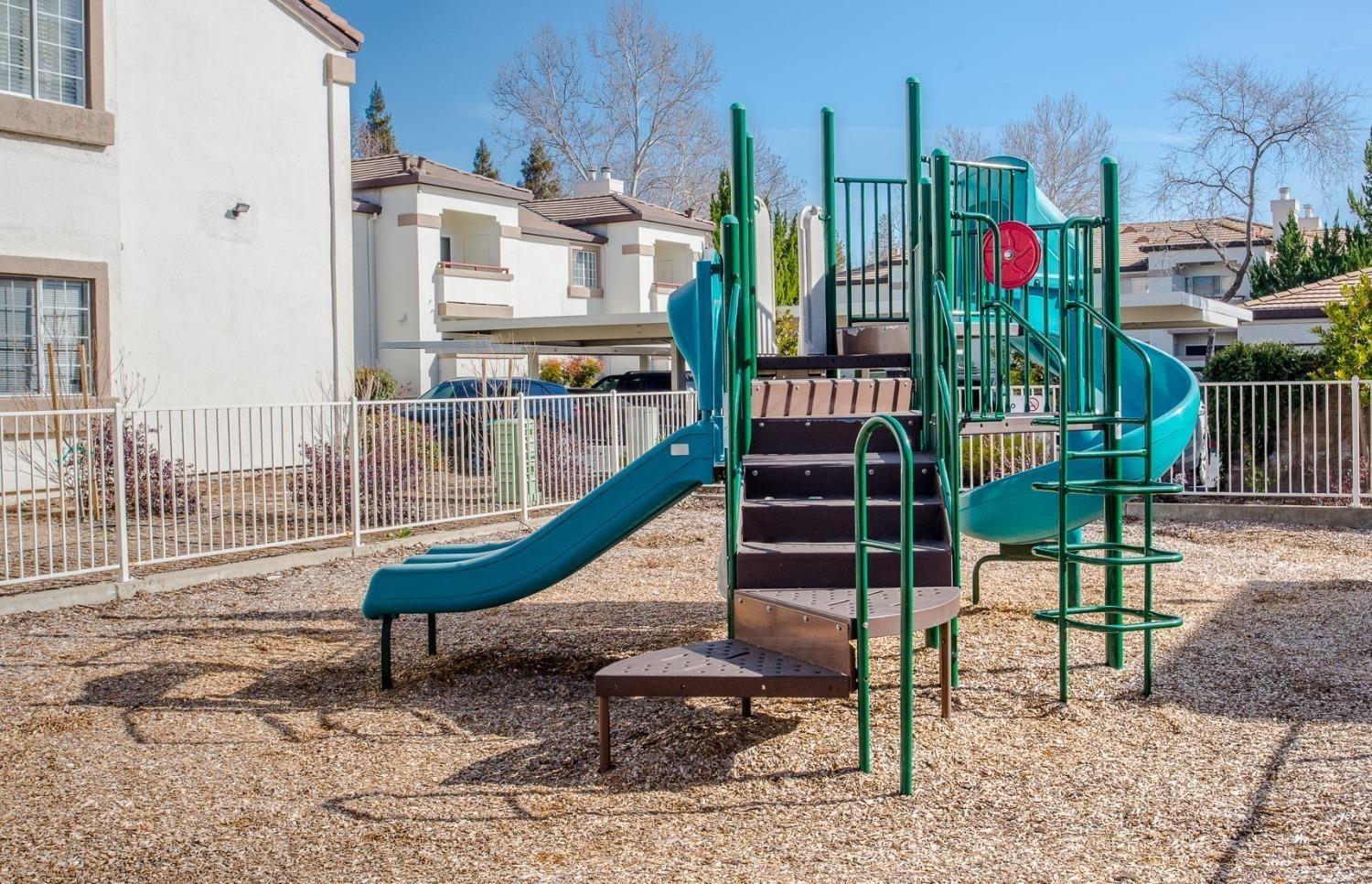 8020 Walerga Road, Unit 1093 Antelope, CA 95843 - Photo 5 of 13 a view of tall buildings with a park