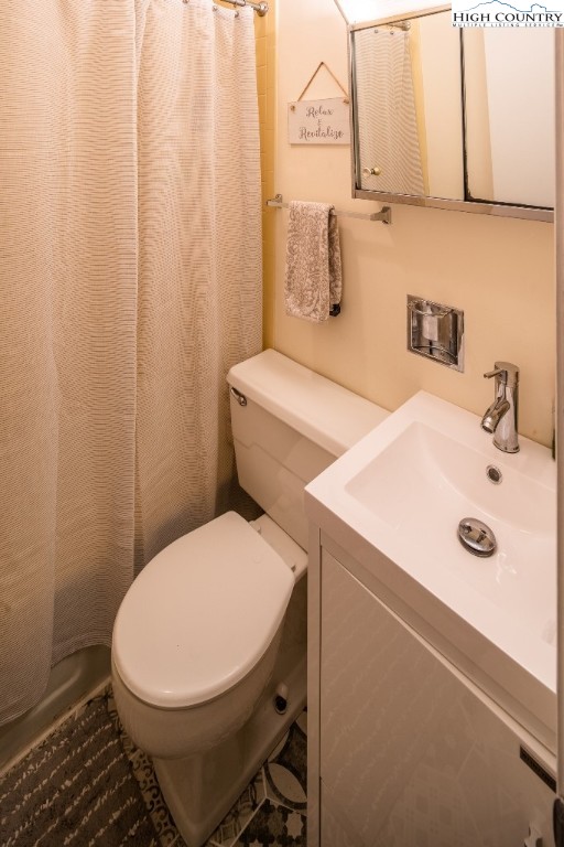 228 Pine Ridge Road Beech Mountain, NC 28604 - Photo 25 of 33 a bathroom with a sink and a toilet