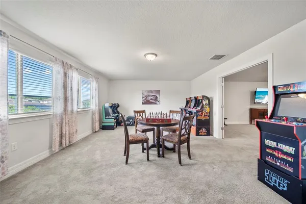 a view of a livingroom with furniture and window