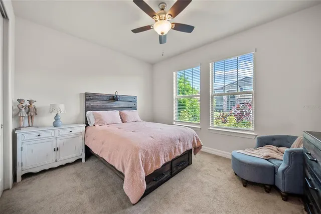 a bed room with a bed and a window