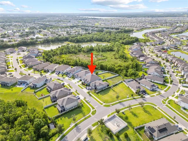 an aerial view of residential houses with outdoor space