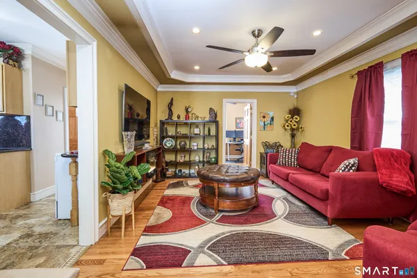 a living room with furniture and a rug