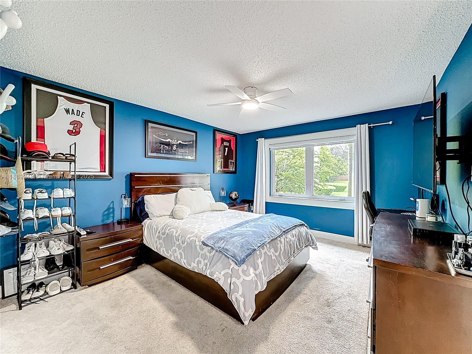 10462 Southwest 121st Street Miami, FL 33176 - Photo 12 of 35 a bedroom with a bed and a couch