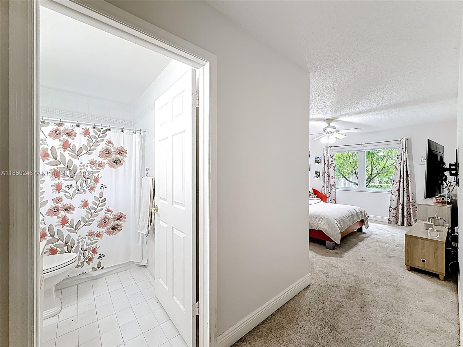 10462 Southwest 121st Street Miami, FL 33176 - Photo 20 of 35 a view of bedroom with furniture and large window