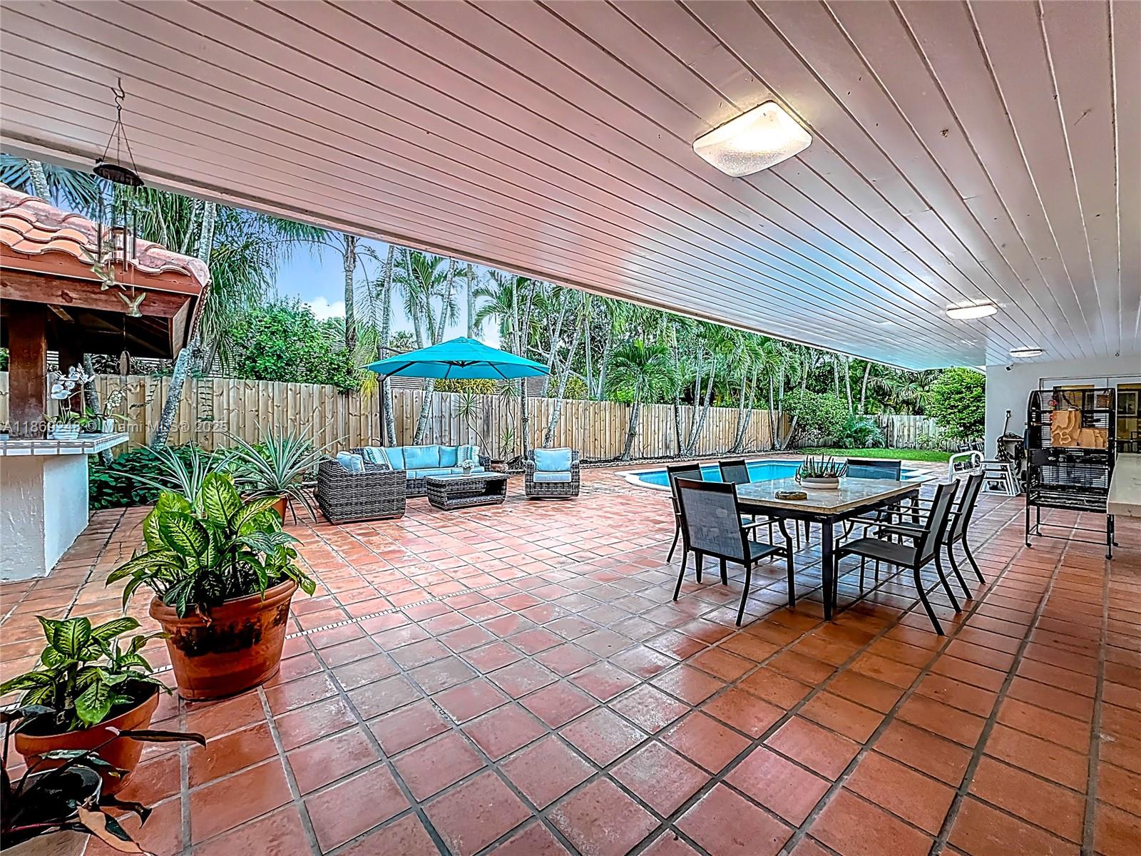 10462 Southwest 121st Street Miami, FL 33176 - Photo 32 of 35 a outdoor space with a patio