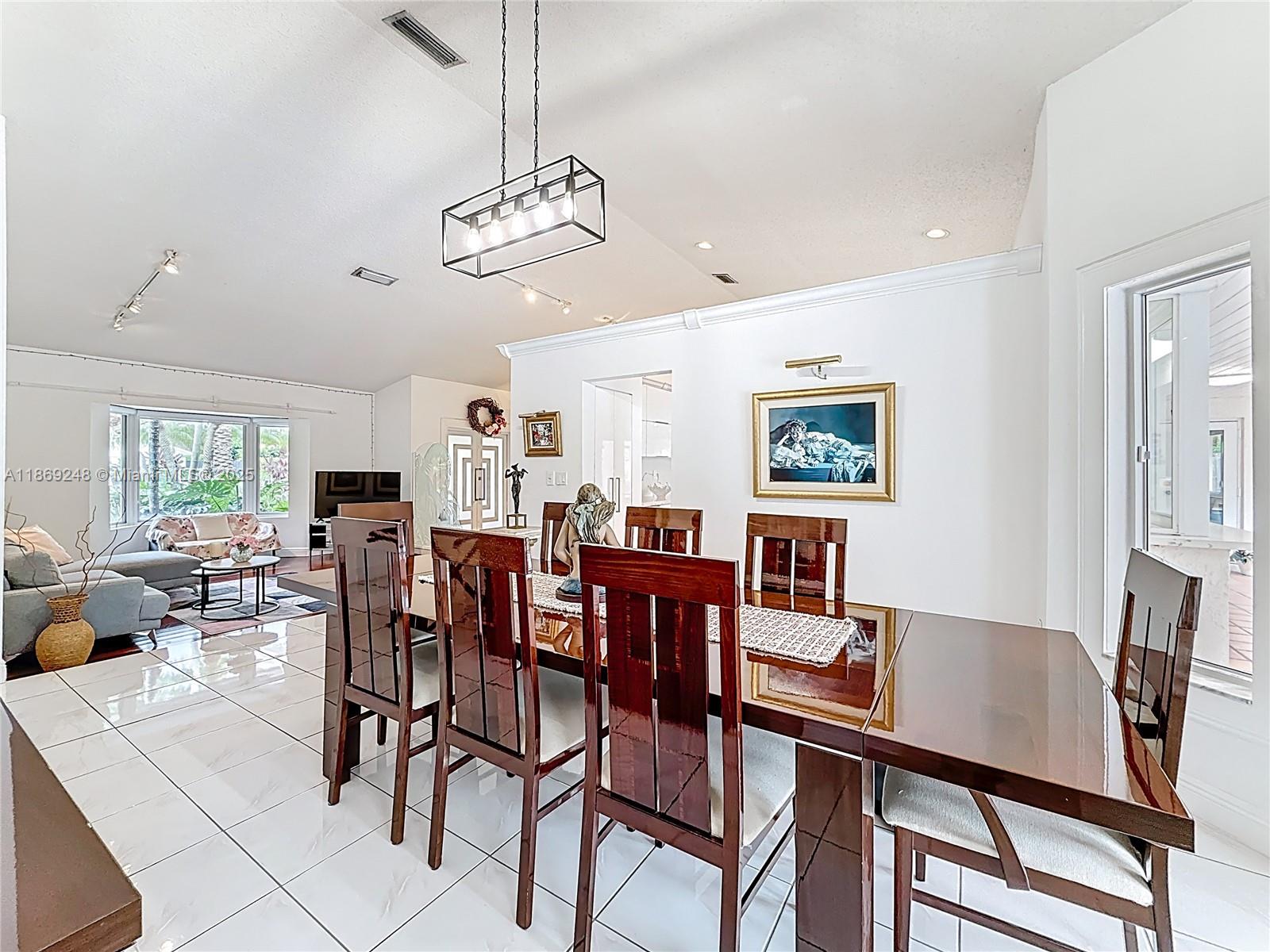 10462 Southwest 121st Street Miami, FL 33176 - Photo 5 of 35 a view of a dining room with furniture