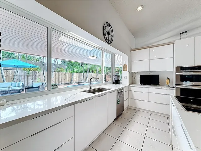 a kitchen with a sink and a stove