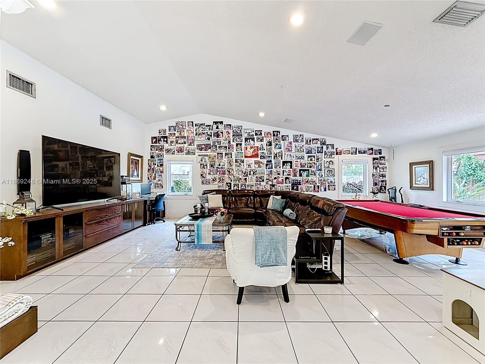 10462 Southwest 121st Street Miami, FL 33176 - Photo 8 of 35 a living room with furniture and a flat screen tv