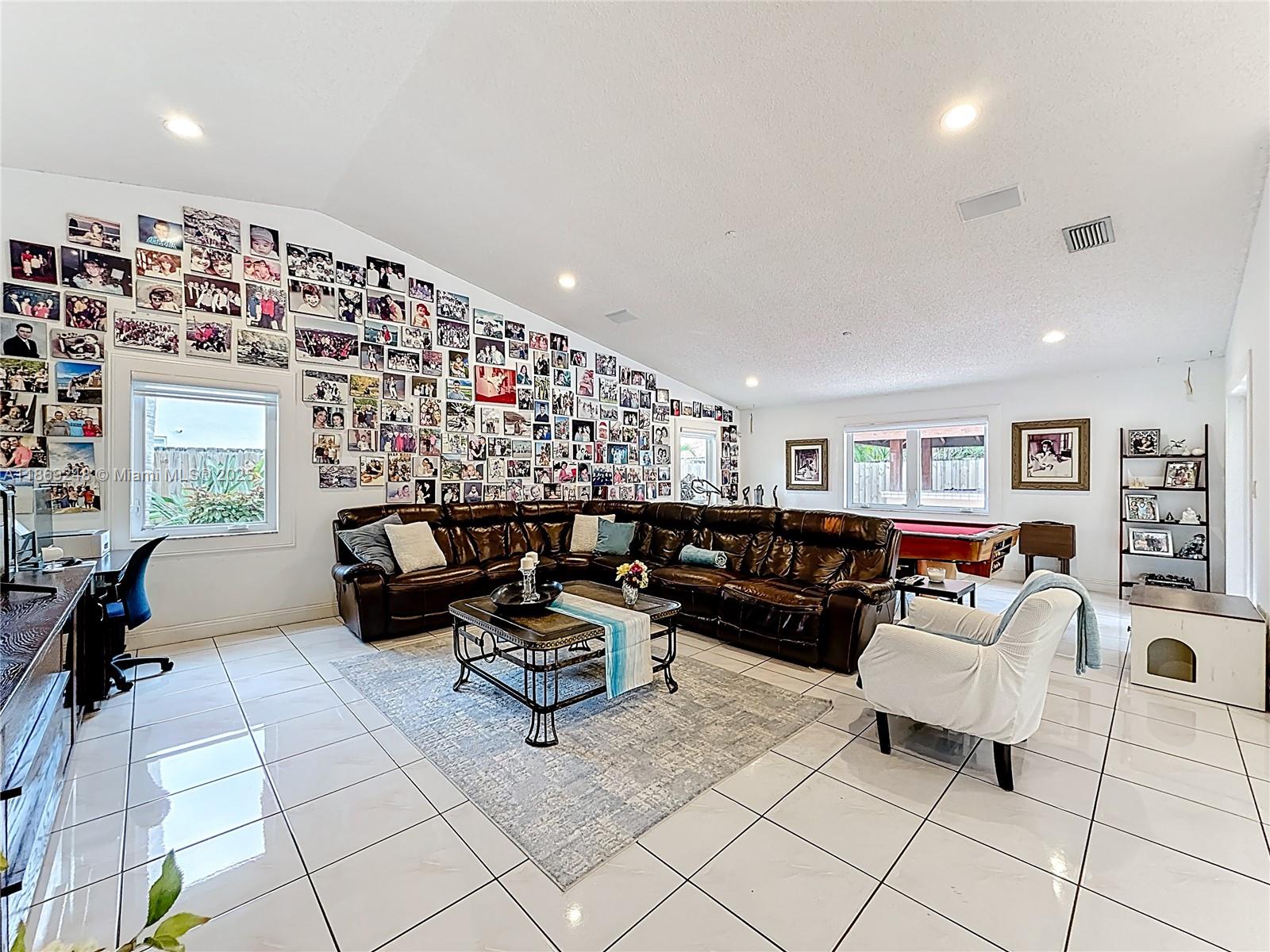 10462 Southwest 121st Street Miami, FL 33176 - Photo 9 of 35 a living room with furniture and a couch