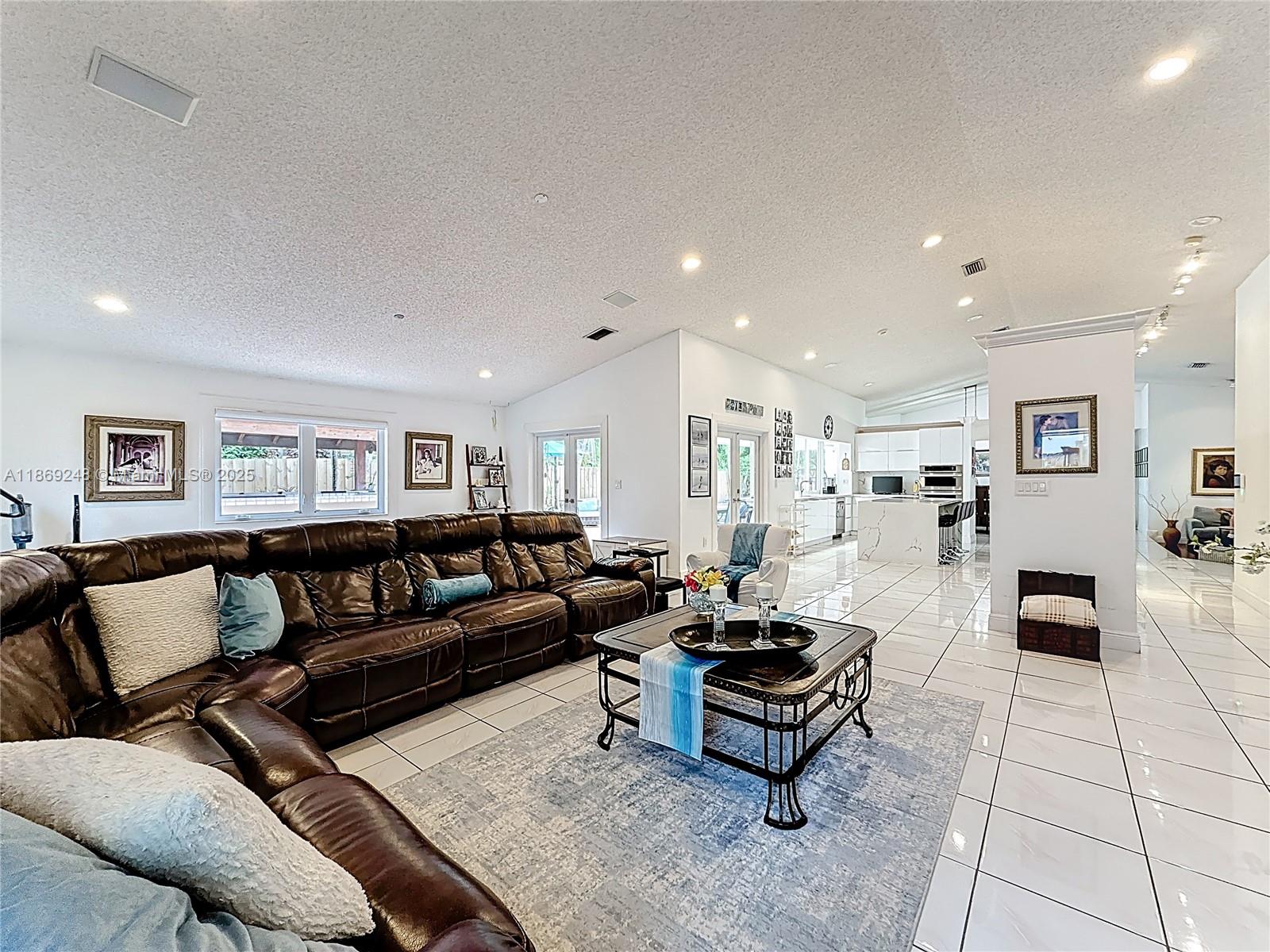 10462 Southwest 121st Street Miami, FL 33176 - Photo 10 of 35 a living room with furniture and wooden floor