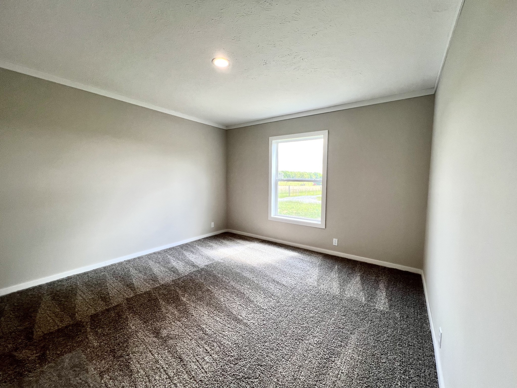 1081 McAfee Road Morrison, TN 37357 - Photo 16 of 39 an empty room with a window