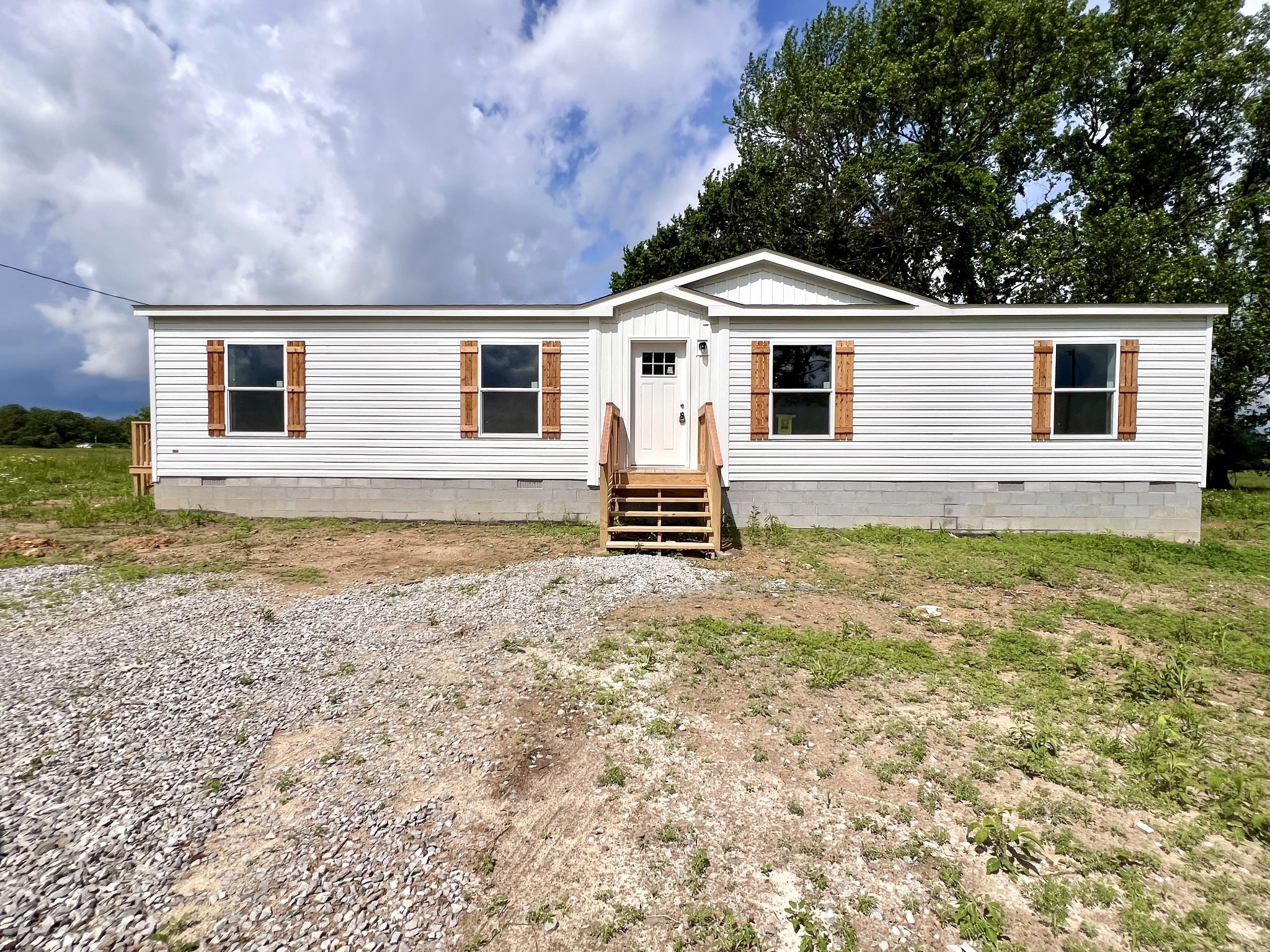 1081 McAfee Road Morrison, TN 37357 - Photo 2 of 39 a front view of a house with a yard