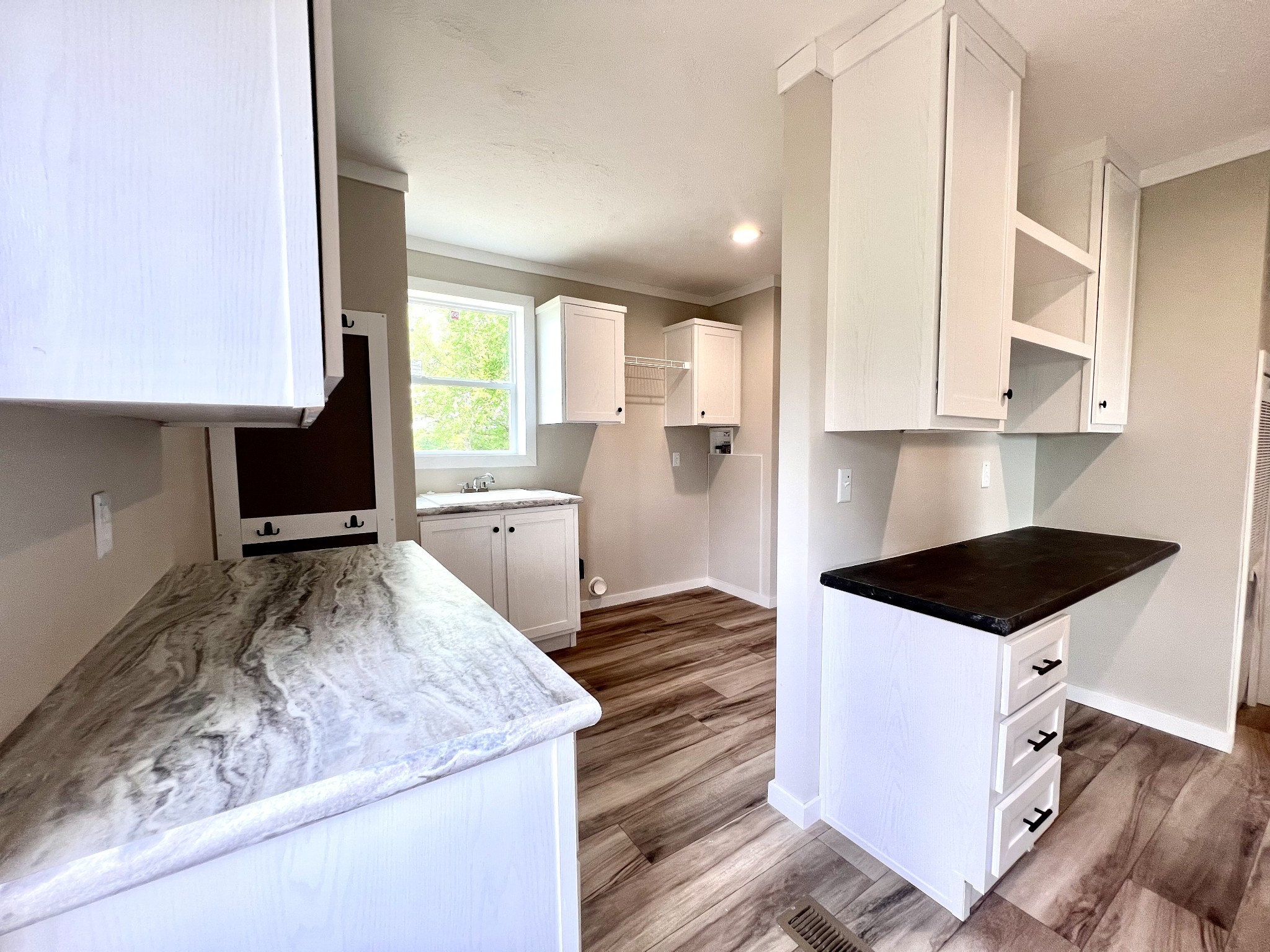 1081 McAfee Road Morrison, TN 37357 - Photo 32 of 39 a kitchen with granite countertop a stove and a sink