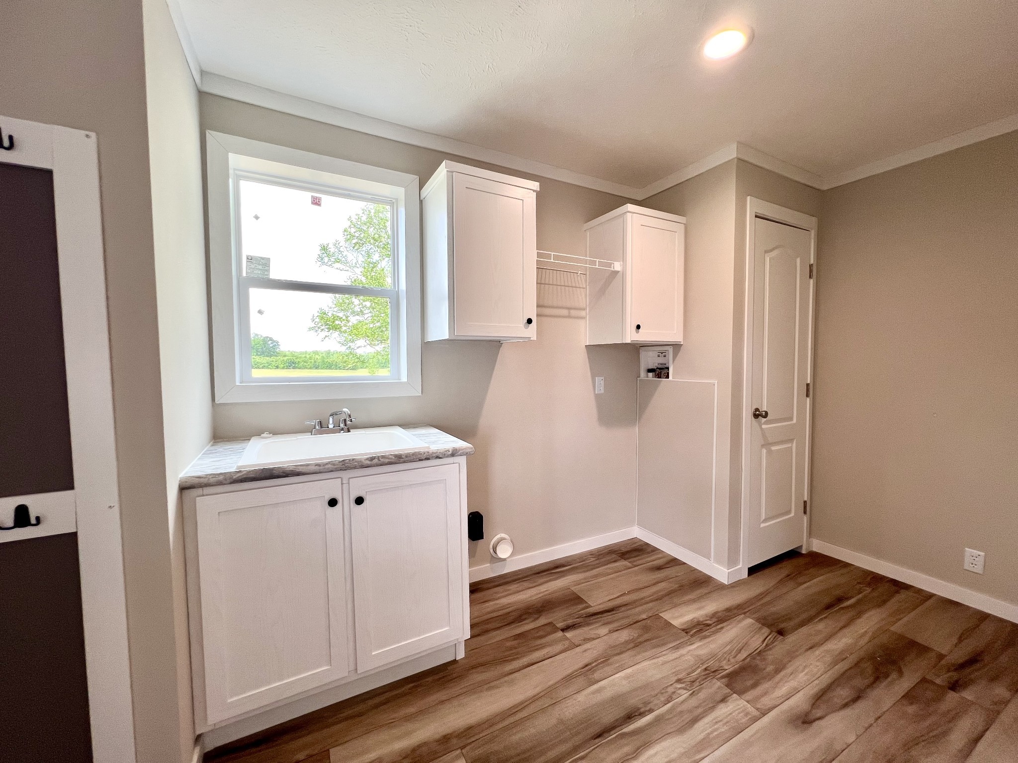 1081 McAfee Road Morrison, TN 37357 - Photo 33 of 39 a view of a kitchen with wooden floor and electronic appliances