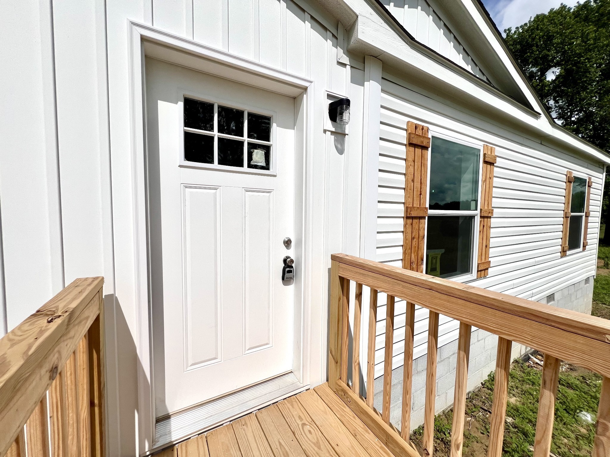 1081 McAfee Road Morrison, TN 37357 - Photo 5 of 39 a view of a balcony with wooden floor and fence