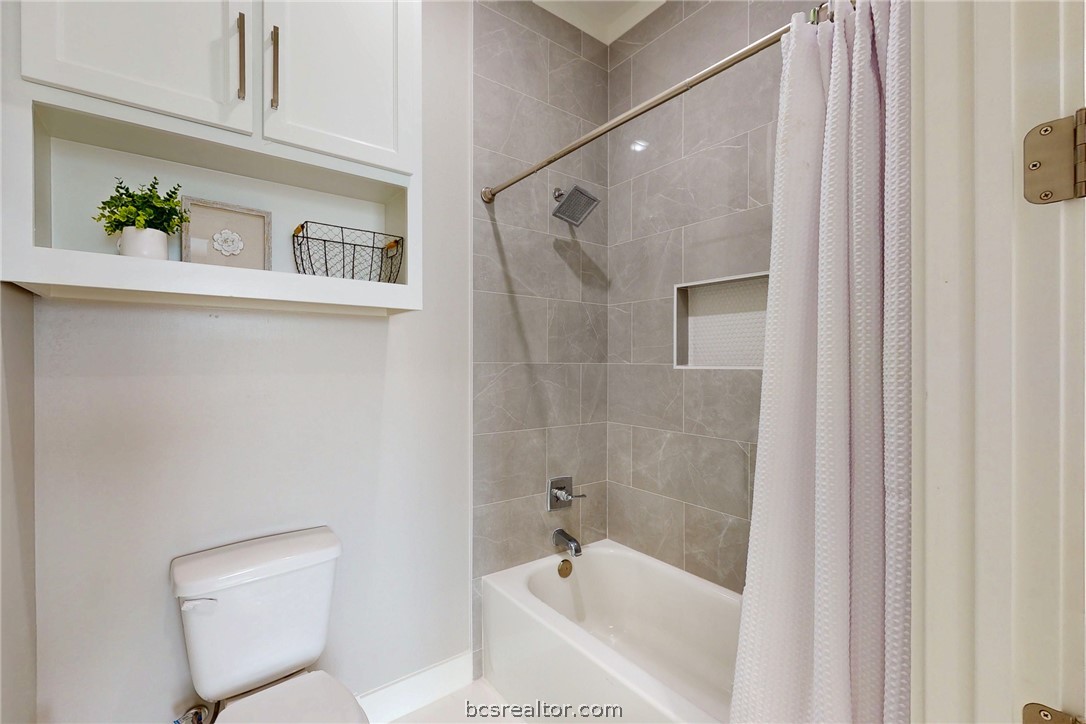 13504 Hudson Farms Road Hearne, TX 77859 - Photo 24 of 48 Premium Finishes: Waterproof wood-look vinyl plank flooring throughout, with exquisite floor-to-ceiling custom tile in all showers and wet areas.