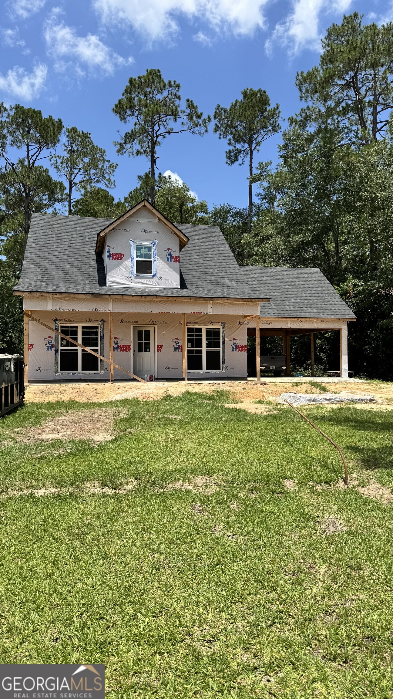 201 New Drive Claxton, GA 30417 - Photo 11 of 21 a front view of a house with a garden