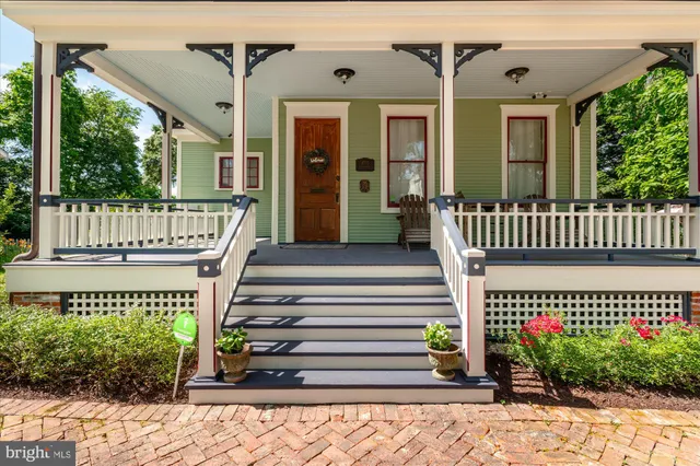 a view of an entryway with wooden floor and stairs