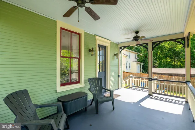 a bedroom with a bed dresser and a window