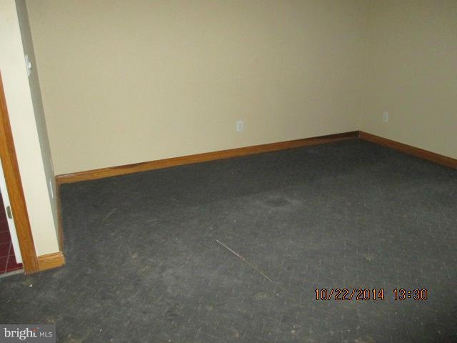 1045 Grovehill Road Baltimore, MD 21227 - Photo 23 of 27 an empty room with a window
