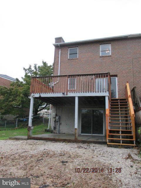 1045 Grovehill Road Baltimore, MD 21227 - Photo 27 of 27 a front view of a house with garden