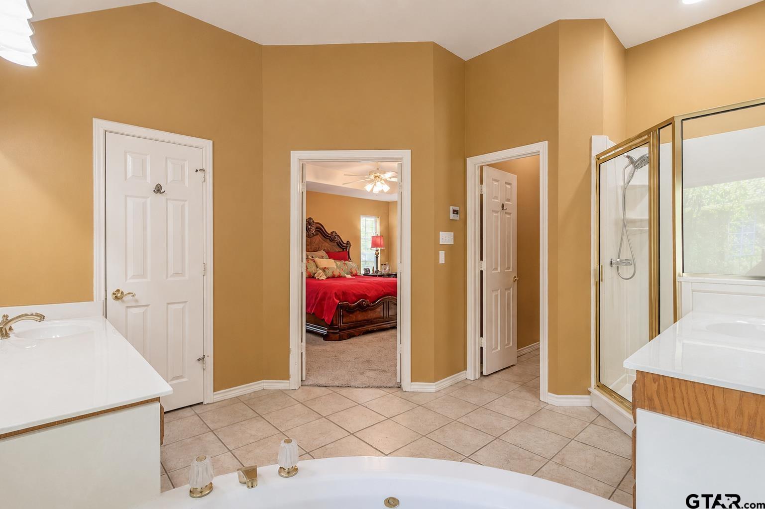 1388 Santa Fe Trail Tyler, TX 75703 - Photo 35 of 46 a bed room with a bed and a refrigerator
