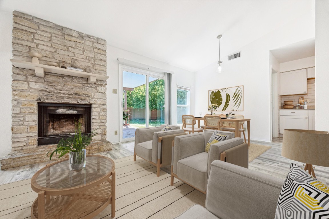 a living room with furniture and a fireplace