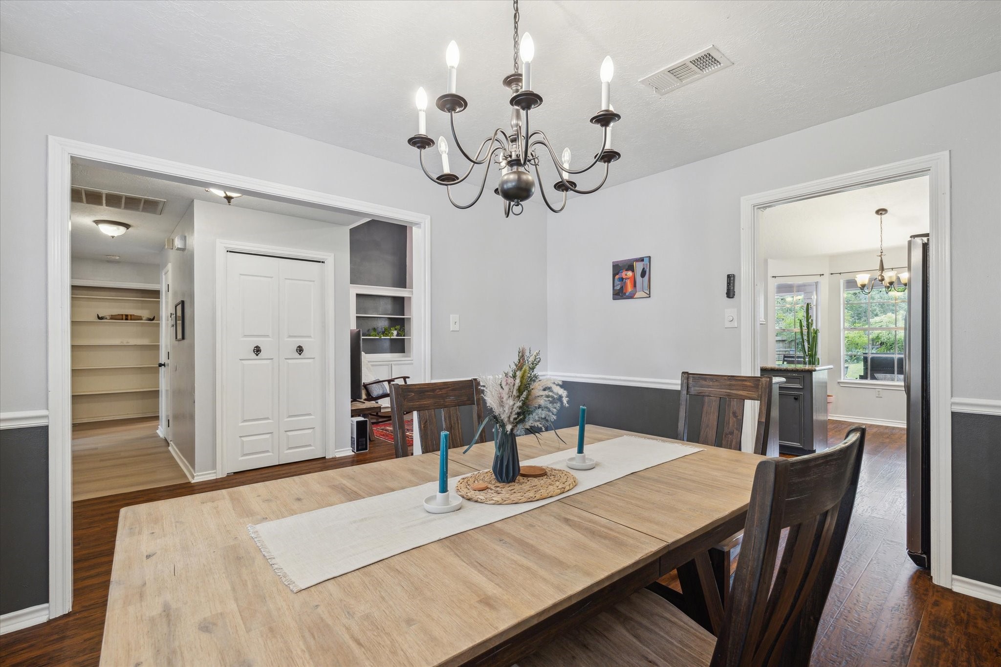 2420 Canter Lane Conroe, TX 77384 - Photo 7 of 24 a view of a dining room with furniture wooden floor and chandelier