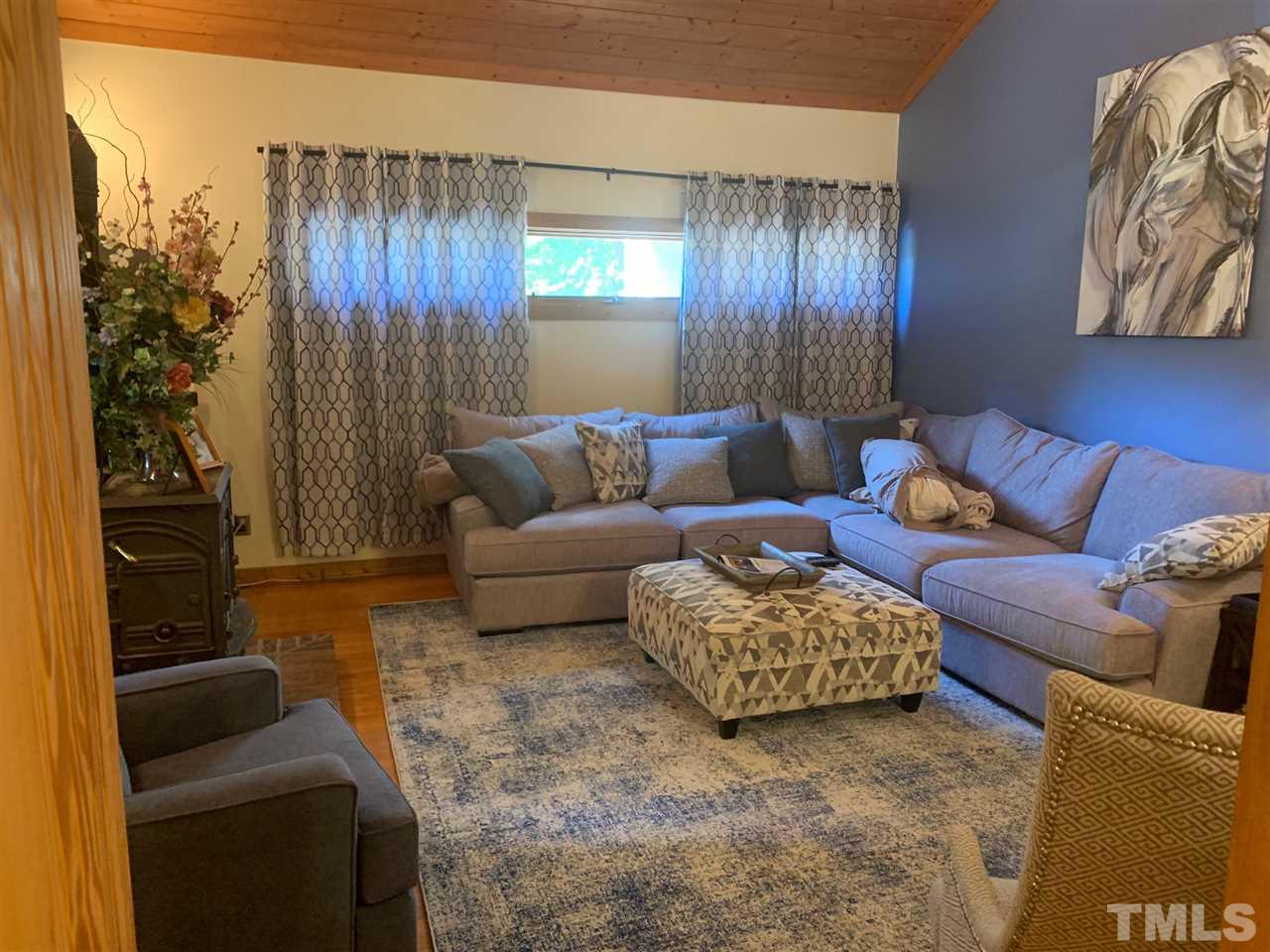 11940 Straight A Way Lane Raleigh, NC 27613 - Photo 2 of 4 a living room with furniture and a window