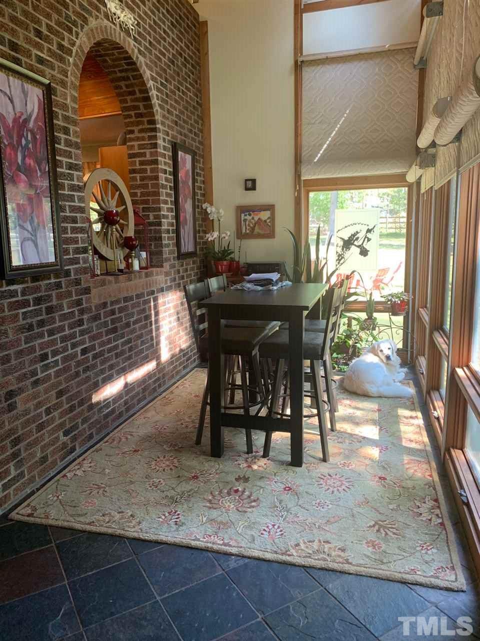 11940 Straight A Way Lane Raleigh, NC 27613 - Photo 4 of 4 a view of a dining room with furniture window and outside view