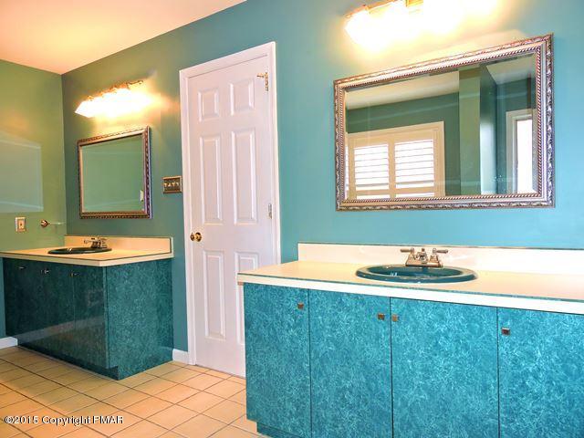 248 Pin Oak Road Stroudsburg, PA 18360 - Photo 21 of 33 a bathroom with a sink and a mirror