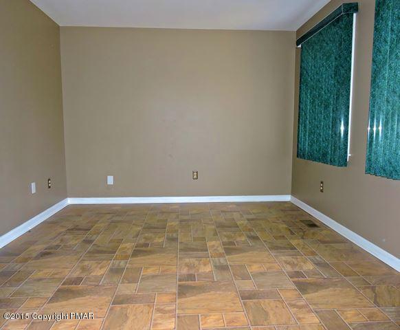 248 Pin Oak Road Stroudsburg, PA 18360 - Photo 9 of 33 a view of a room with a wooden floor and a window